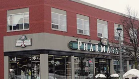 The red-brick building at 29 Main Street East with Pharmasave on the ground floor